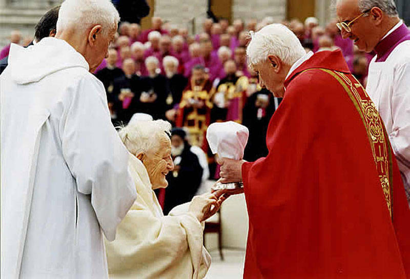 Anti Pope Benedict XVI giving "communion" in the hand to non-Catholic Roger Schutz