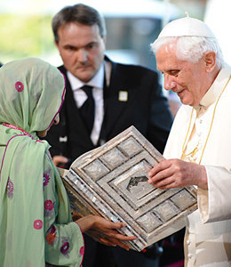 Anti Pope Francis' predecessor Benedict XVI receiving a Koran