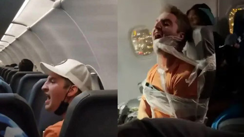 airplane passenger duct taped to seat