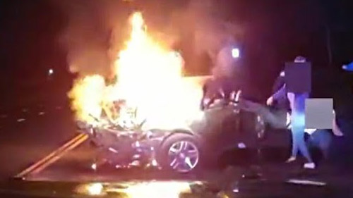 Man Pulled Through Window Of Car Engulfed In Flames - 1 minute video